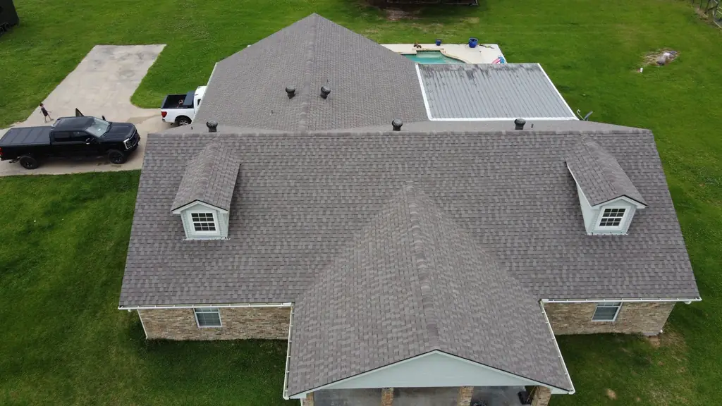 Large completed residential roof with dormers, photographed from above by ABCO